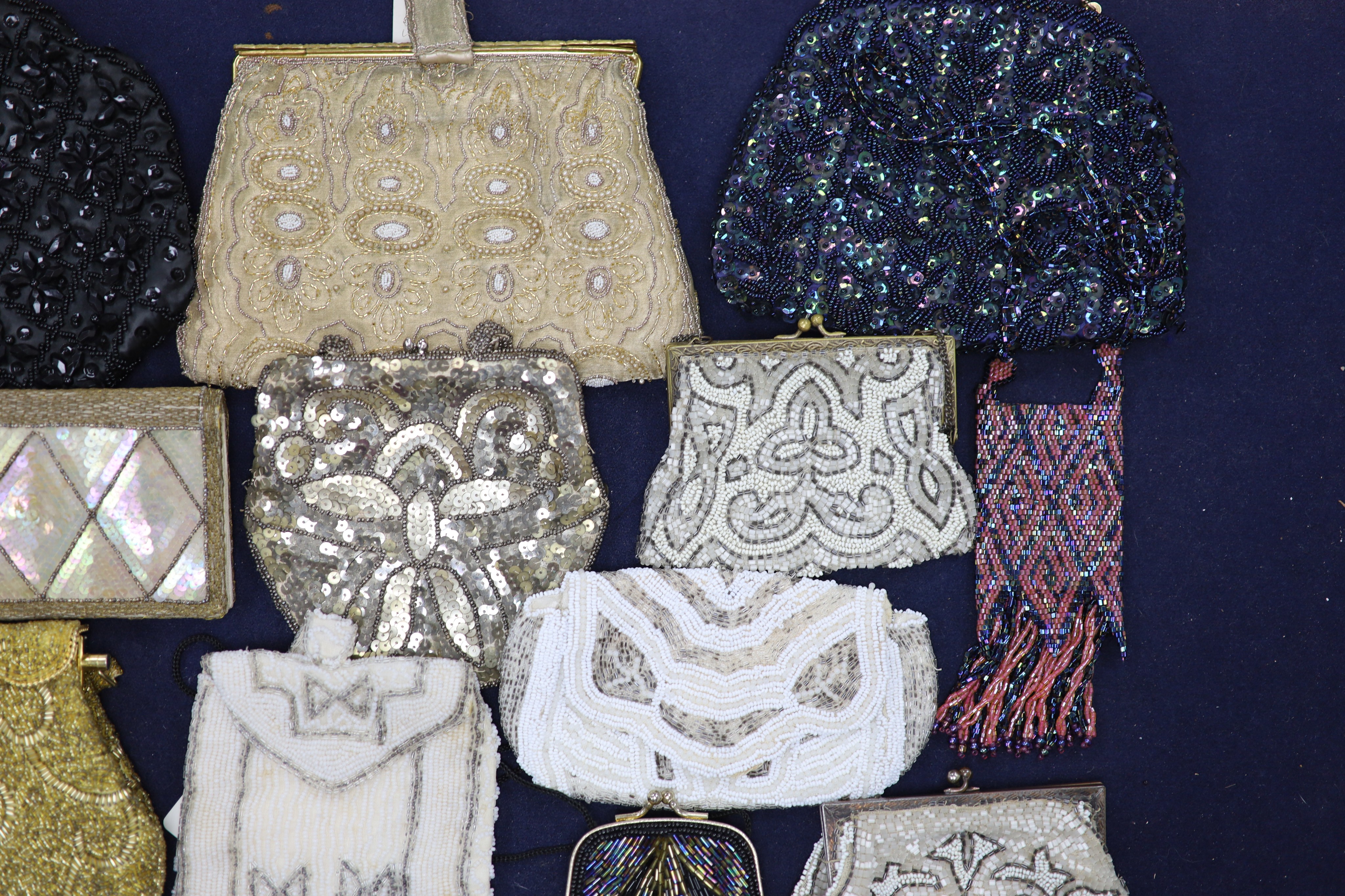 A collection of approximately fifty Victorian and later beadwork, white metal and fabric purses etc.